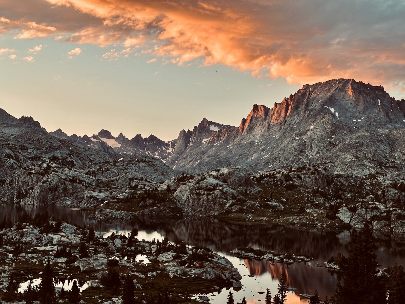 Wind River Range peaks at sunset with alpine lake reflection